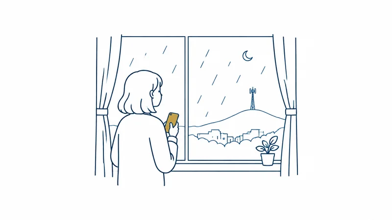 台風の夜、スマホを手に窓の外の雨を見る人の絵